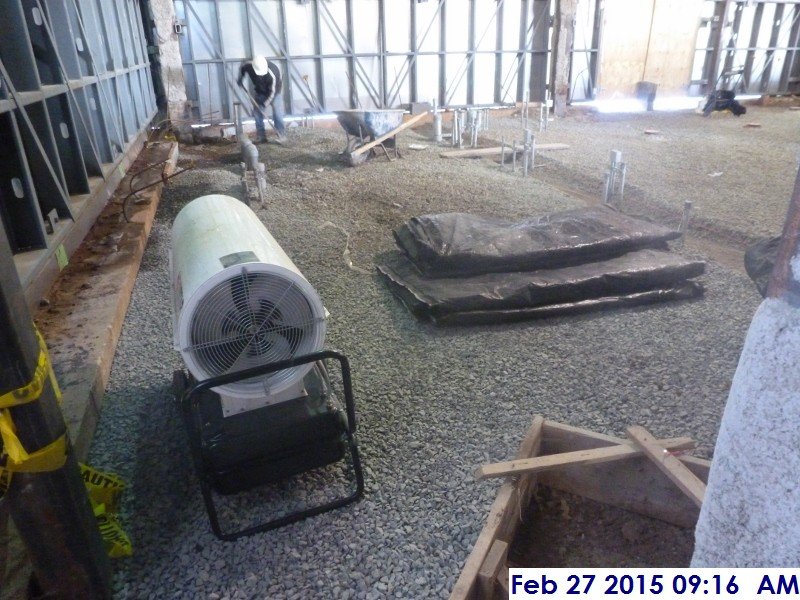 Installing gravel at Electrical Room Facing North